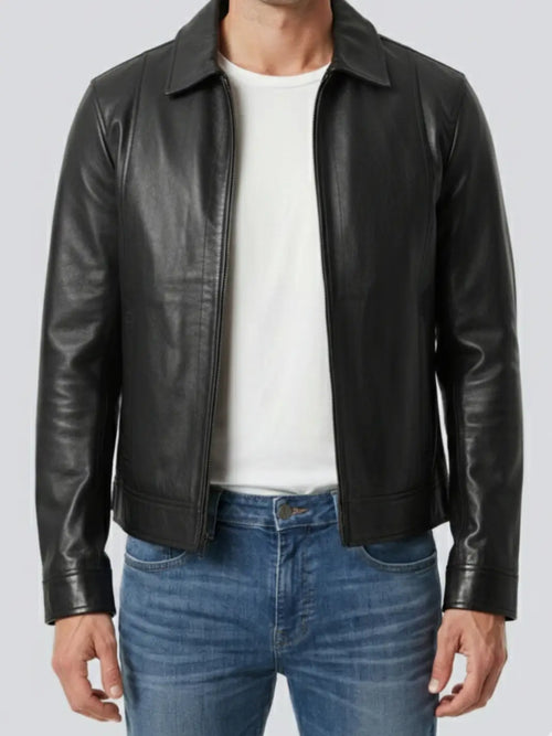 Black leather jacket worn by a person on a plain background